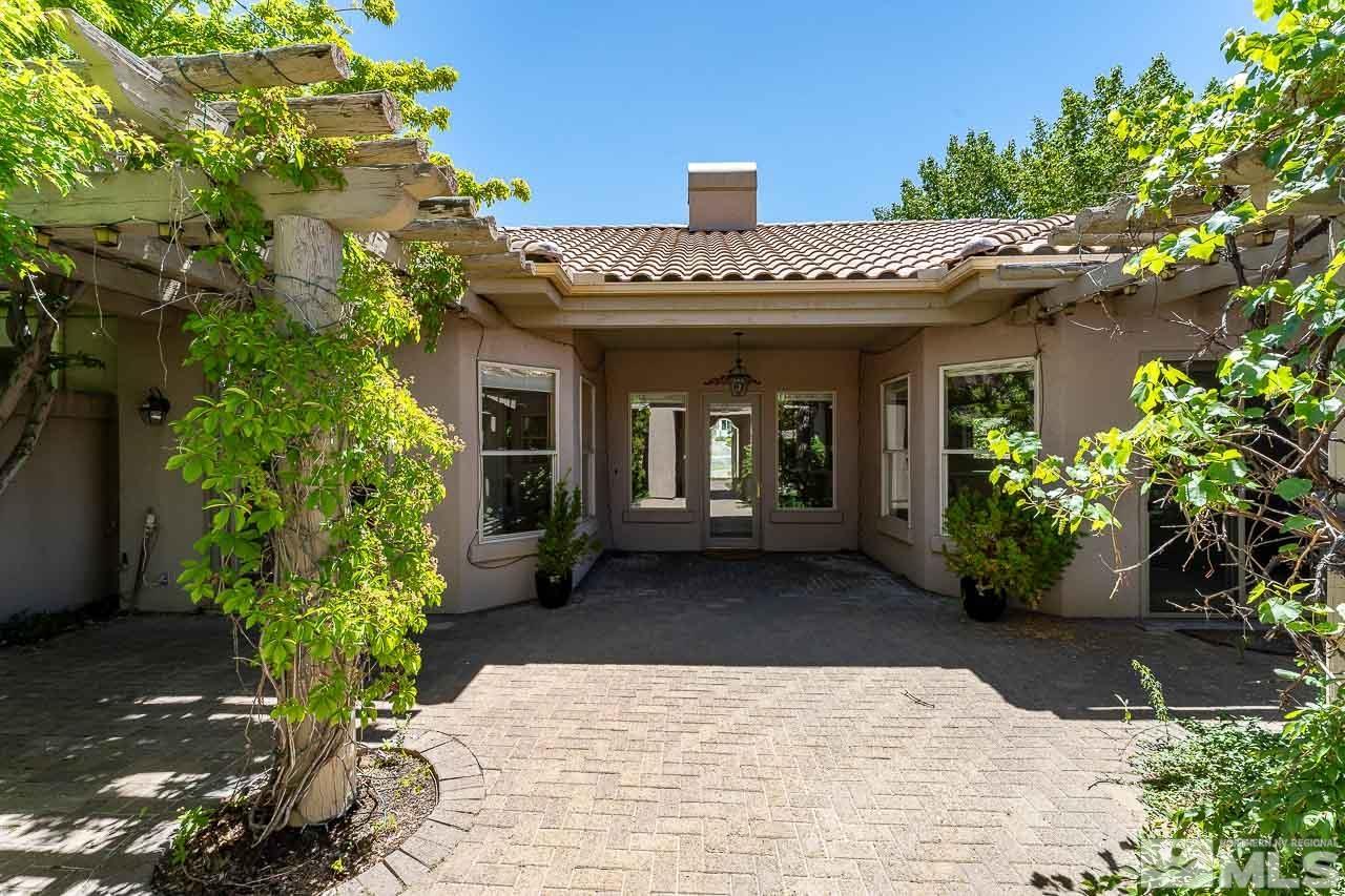 4440 Juniper Trail Reno, NV 89519 - Photo 7 of 29 a view of a house with potted plants