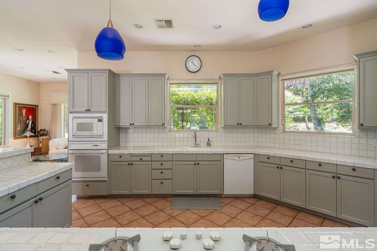 4440 Juniper Trail Reno, NV 89519 - Photo 9 of 29 a kitchen with a sink cabinets and window