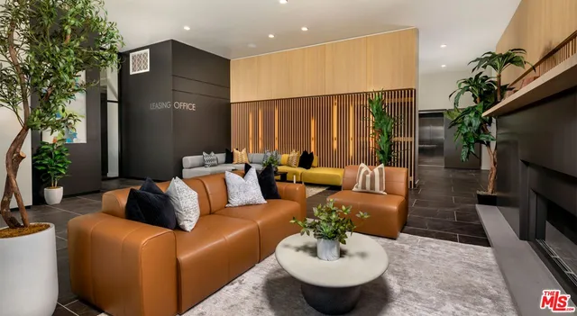 a living room with furniture and a rug