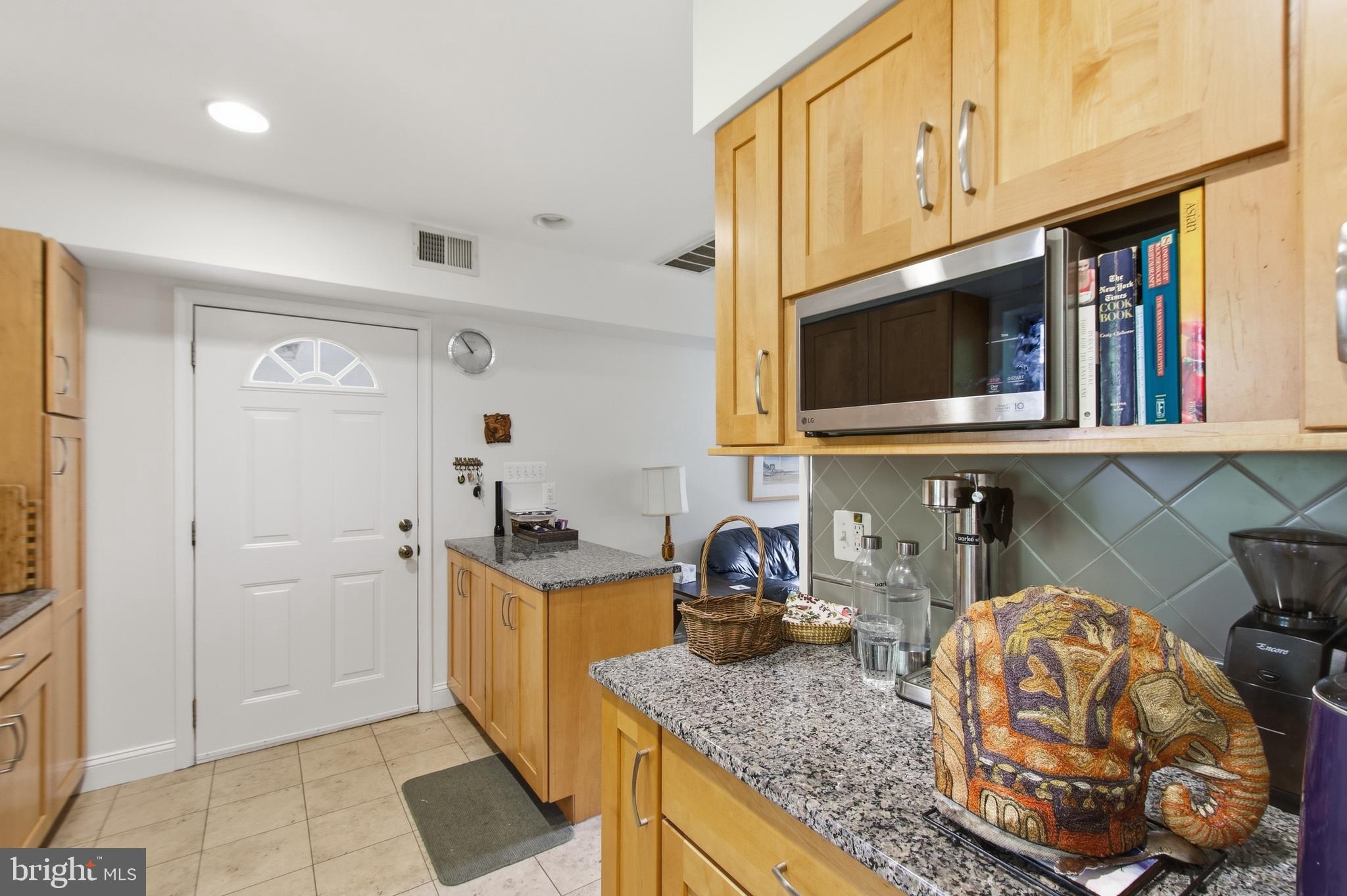 215 West George Mason Road Falls Church, VA 22046 - Photo 14 of 50 a kitchen with stainless steel appliances granite countertop a sink and a stove