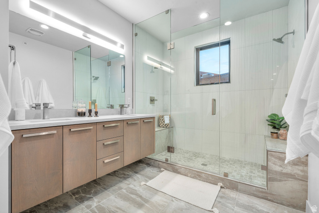 1258 Rothwell Road Park City, UT 84060 - Photo 18 of 48 Contemporary bathroom featuring a floating dual vanity with light wood-finish cabinetry and chrome fixtures