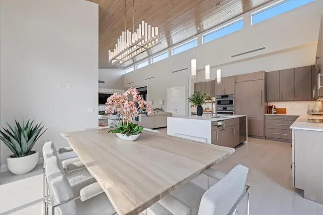 a kitchen with stainless steel appliances granite countertop a stove and a refrigerator