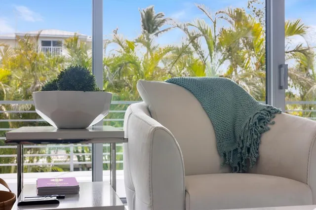 a en suite bathroom with a granite countertop tub and a potted plant