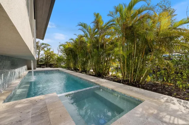a view of a lake with boats and trees in the background