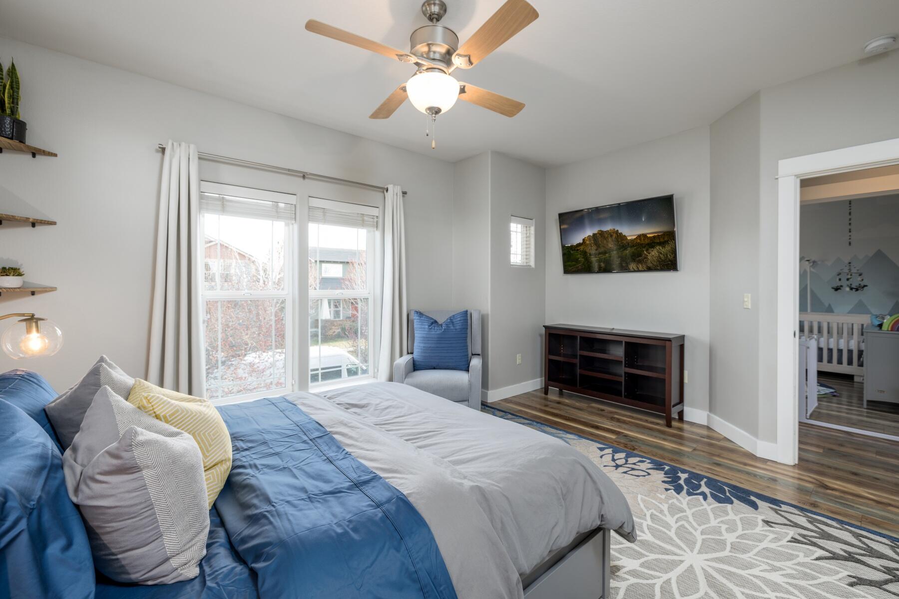 62732 Larkview Road Bend, OR 97701 - Photo 14 of 26 a bedroom with a bed and a fireplace