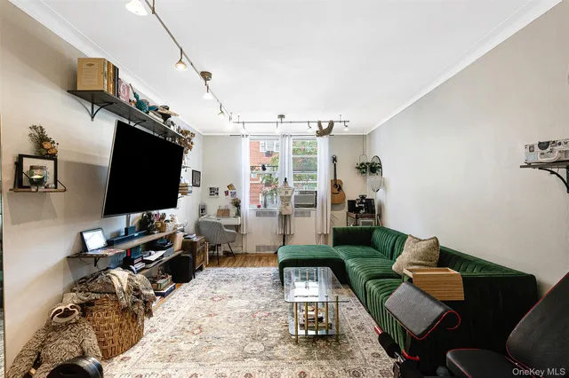 a living room with fireplace furniture and a flat screen tv