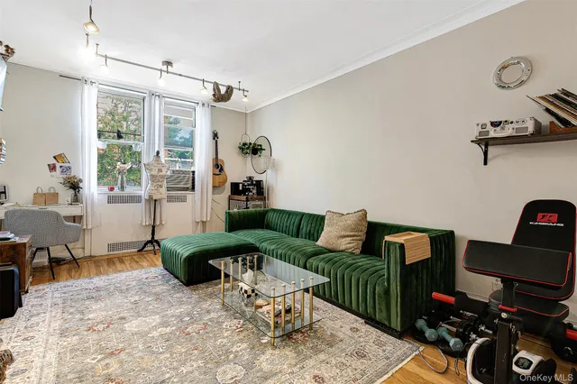 a bedroom with furniture and a flat screen tv