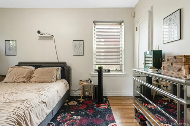 a bedroom with a bed and a tv