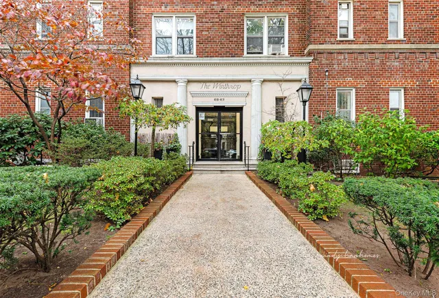 a view of a living room with furniture and a fireplace