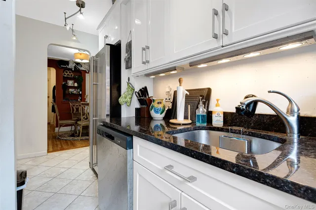 a living room with furniture a rug and a window