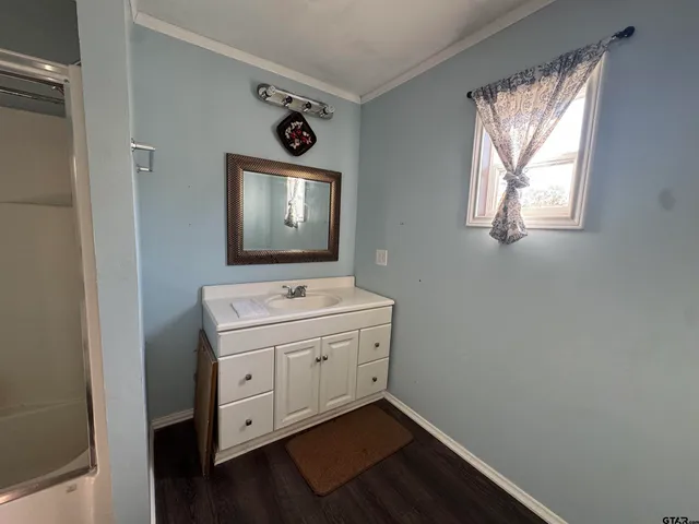 a room with a fan and a window