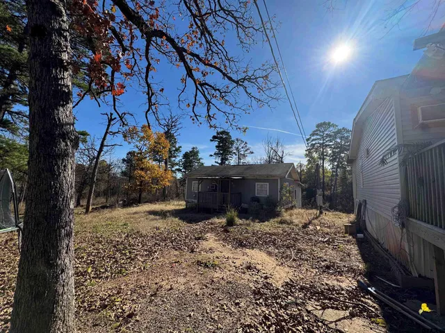 a backyard of a house with lots of green space