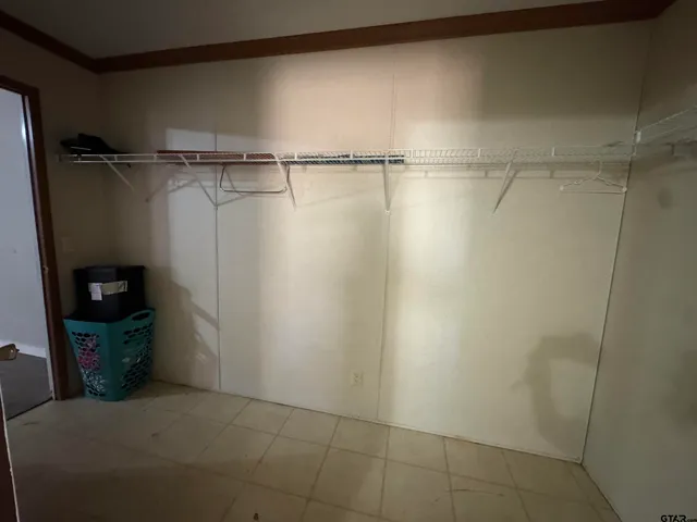 a view of a room with racks on the wall