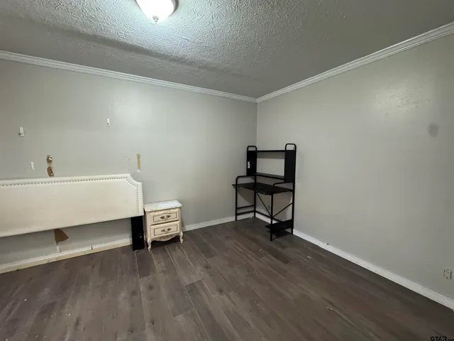 a room with a wooden floor and a chair