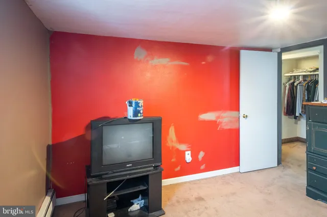 a view of a livingroom with furniture and a flat screen tv