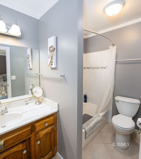 413 South Valley Street Ridgecrest, CA 93555 - Photo 23 of 40 a bathroom with a sink a toilet and shower