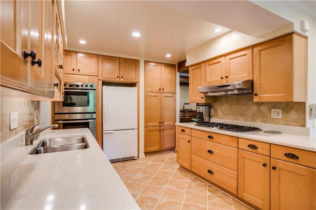 8412 Post Road Allison Park, PA 15101 - Photo 8 of 25 The kitchen has been totally remodeled with quartz counter tops, maple cabinets, Bosch double stainless steel ovens and a five burner gas cook top. Custom drawers, glass cabinets and large pantry and heated ceramic tile flooring!!