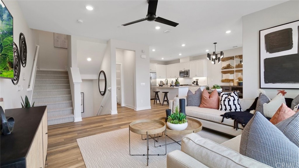 264 Siena Lake Forest, CA 92630 - Photo 2 of 27 a living room with furniture kitchen view and a chandelier