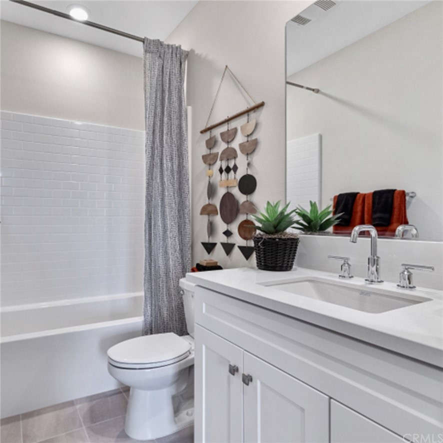 264 Siena Lake Forest, CA 92630 - Photo 17 of 27 a bathroom with a sink a toilet and shower