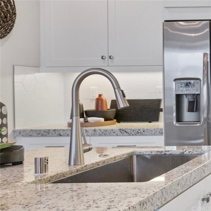 264 Siena Lake Forest, CA 92630 - Photo 6 of 27 a view of a kitchen with a sink and dishwasher