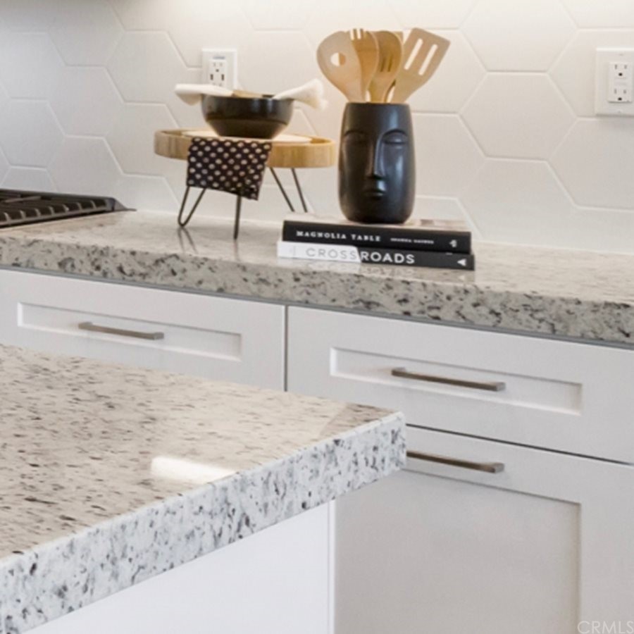 264 Siena Lake Forest, CA 92630 - Photo 8 of 27 a kitchen with a stove a sink and a refrigerator