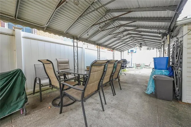 a view of a chairs and table in the patio