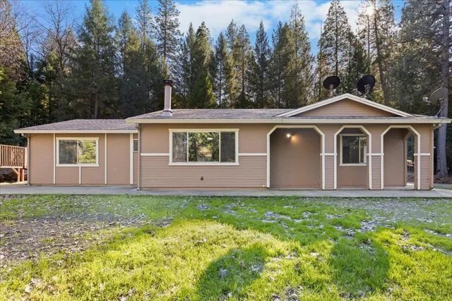 a front view of a house with a yard