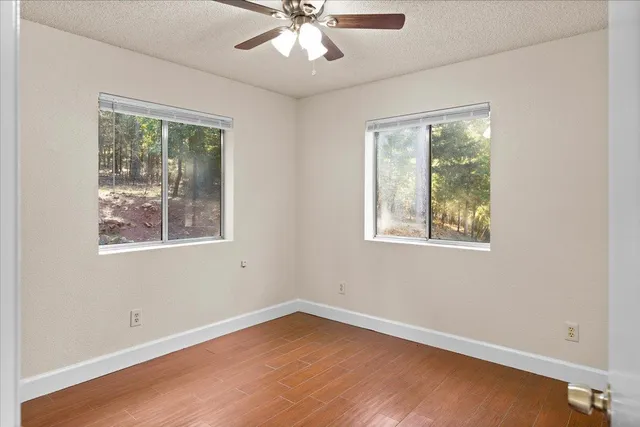 a view of an empty room with a fireplace