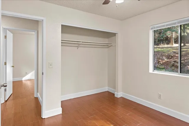a view of a room with wooden walls
