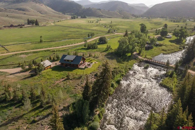 a view of a town with mountains in the background