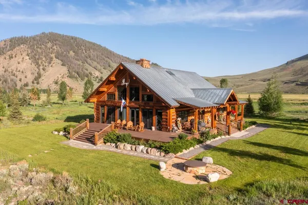 a view of a house with a big yard