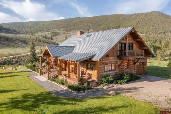 a aerial view of a house with a yard