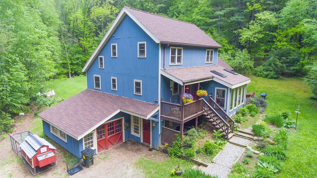 91 Long Hill Road Leverett, MA 01054 - Photo 1 of 29 a aerial view of a house with swimming pool next to a yard