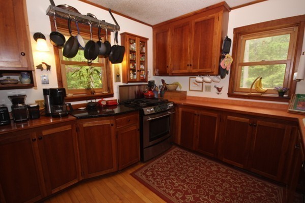 91 Long Hill Road Leverett, MA 01054 - Photo 13 of 29 a kitchen with a sink cabinets stainless steel appliances and a window