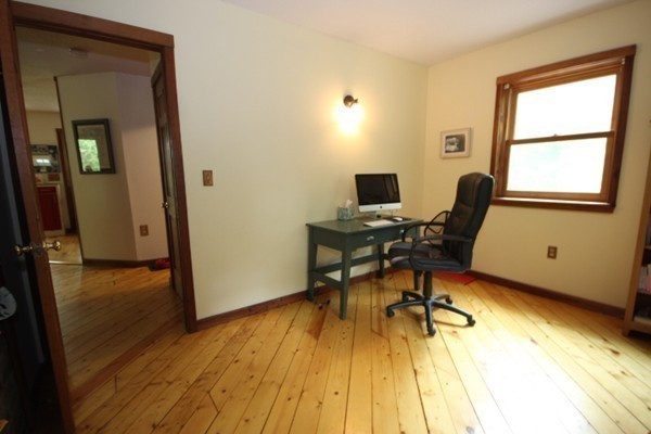 91 Long Hill Road Leverett, MA 01054 - Photo 20 of 29 a view of a workspace with wooden floor and a window