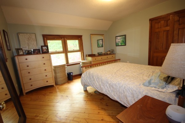 91 Long Hill Road Leverett, MA 01054 - Photo 22 of 29 a spacious bedroom with a bed and a window