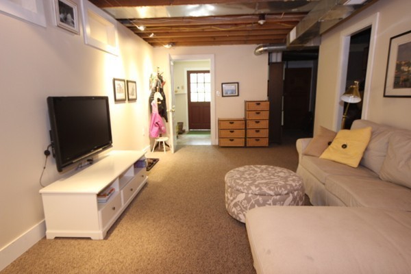 91 Long Hill Road Leverett, MA 01054 - Photo 24 of 29 a living room with furniture and a flat screen tv