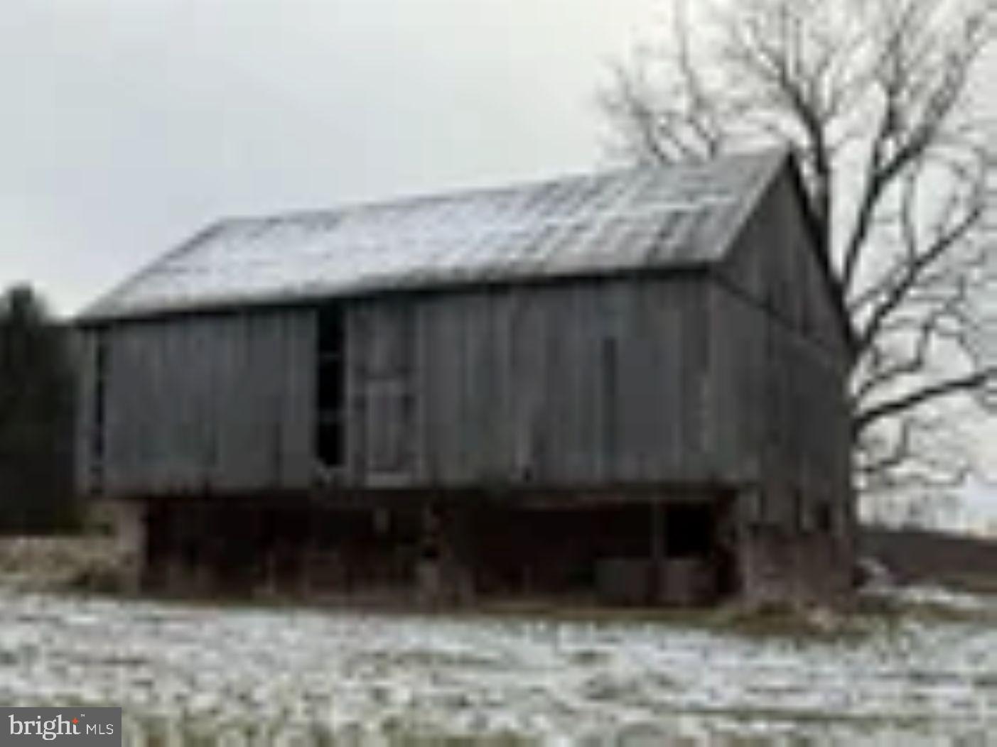 18951 Amberson Road Spring Run, PA 17262 - Photo 2 of 44 a wooden door in a backyard