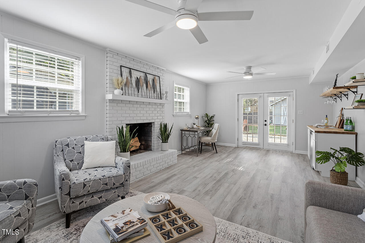 408 Latimer Road Raleigh, NC 27609 - Photo 14 of 19 a living room with furniture and a fireplace