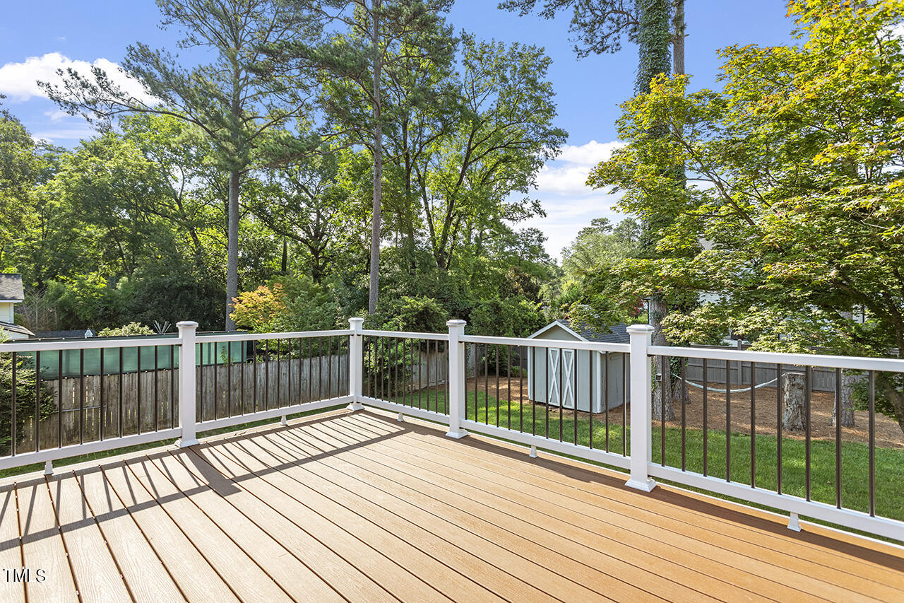 408 Latimer Road Raleigh, NC 27609 - Photo 17 of 19 a view of balcony with wooden floor and fence