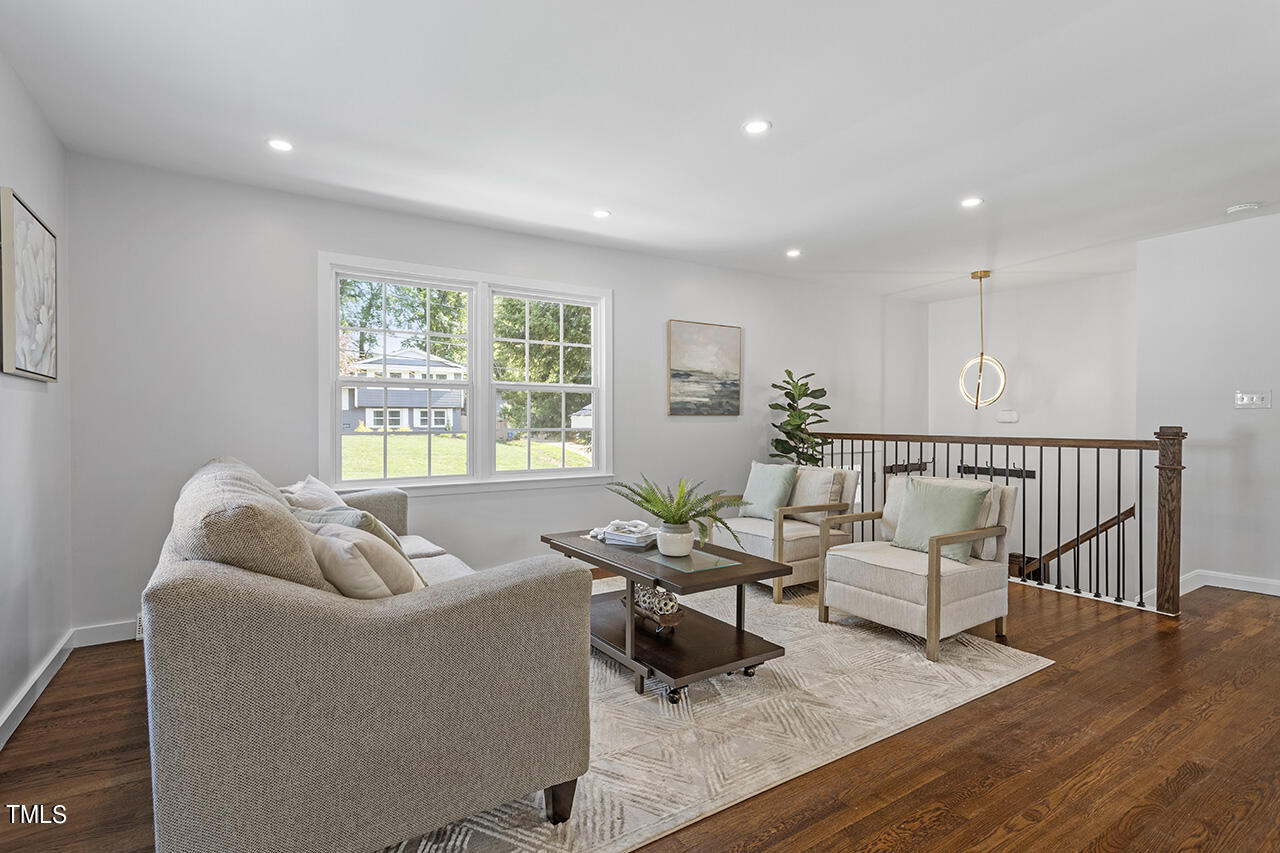 408 Latimer Road Raleigh, NC 27609 - Photo 4 of 19 a living room with furniture and windows