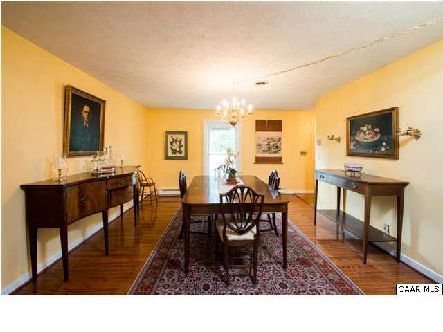 2713 Huntington Road Charlottesville, VA 22901 - Photo 3 of 17 a living room with dining room and a table