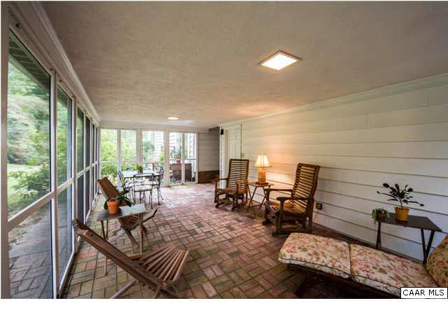 2713 Huntington Road Charlottesville, VA 22901 - Photo 6 of 17 a living room with furniture and a large window