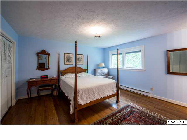 2713 Huntington Road Charlottesville, VA 22901 - Photo 7 of 17 a bedroom with a bed and window