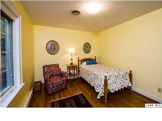 2713 Huntington Road Charlottesville, VA 22901 - Photo 10 of 17 a bedroom with a bed and a window