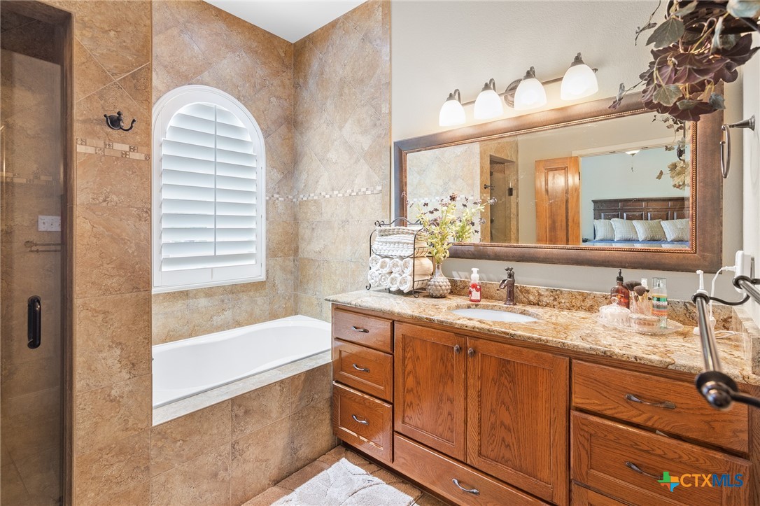 166 Post Oak Bend Inez, TX 77968 - Photo 18 of 48 a bathroom with a sink and a mirror