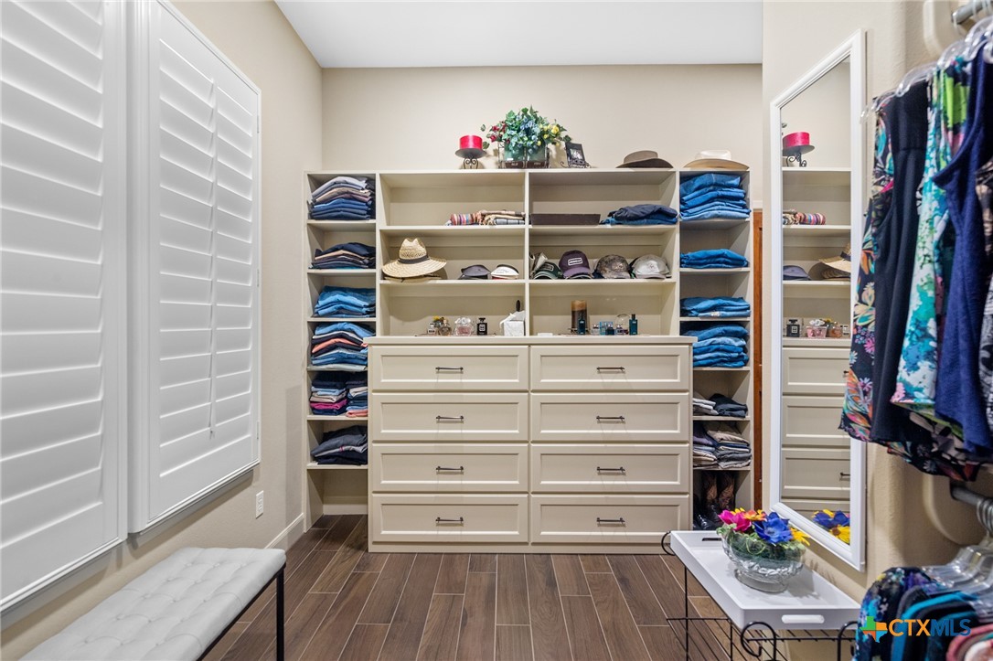166 Post Oak Bend Inez, TX 77968 - Photo 21 of 48 a view of walk in closet with clothes and shoes