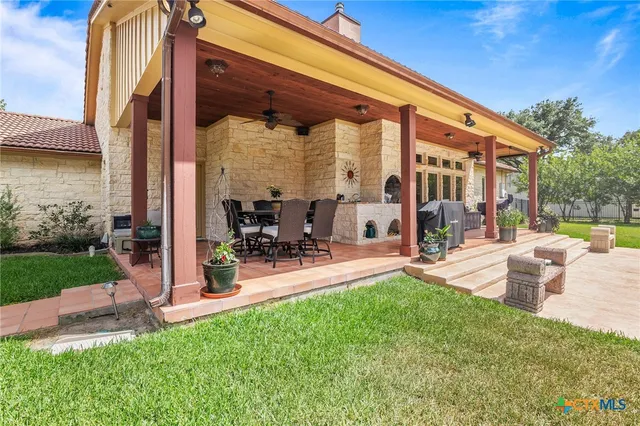 a view of a swimming pool with a patio