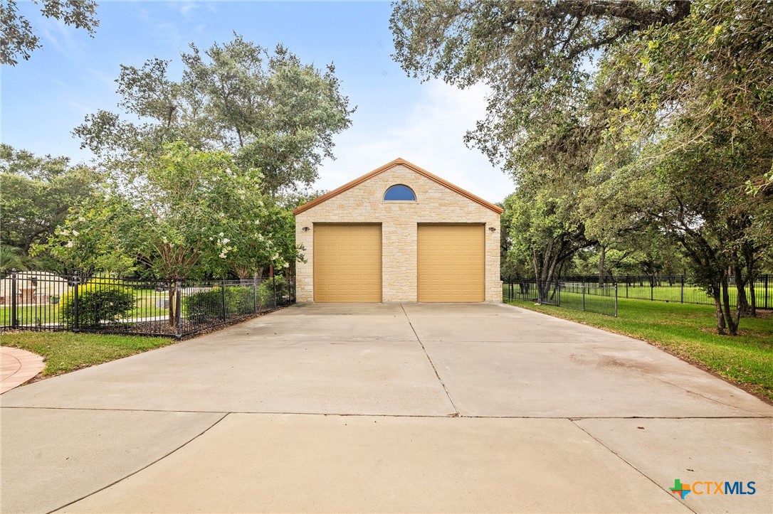 166 Post Oak Bend Inez, TX 77968 - Photo 29 of 48 a front view of a house with a yard and garage