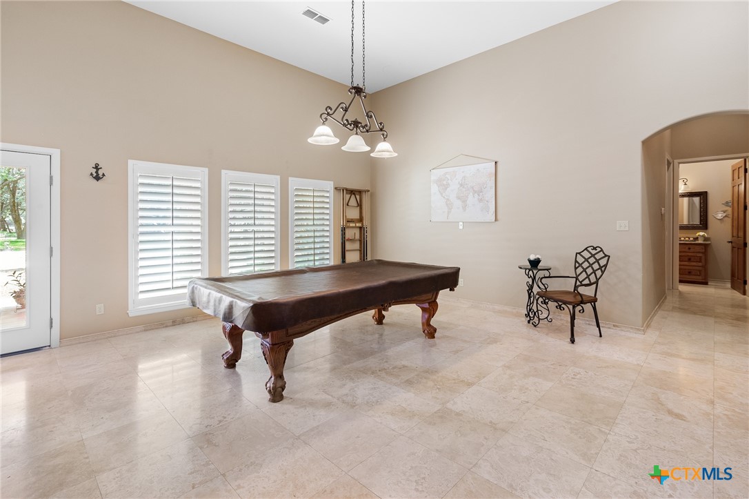 166 Post Oak Bend Inez, TX 77968 - Photo 36 of 48 a living room with furniture and a chandelier
